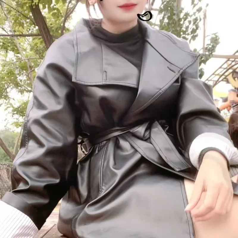 

Leather Jacket Women's Medium Long Autumn Models Korean Version Fashion Sense Stand-up Collar Leather Jacket Belt Trench Coat