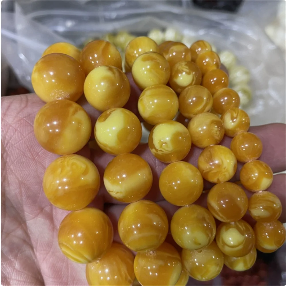 

Optimized Second Generation Amber and Honey Wax Round Bead Bracelet