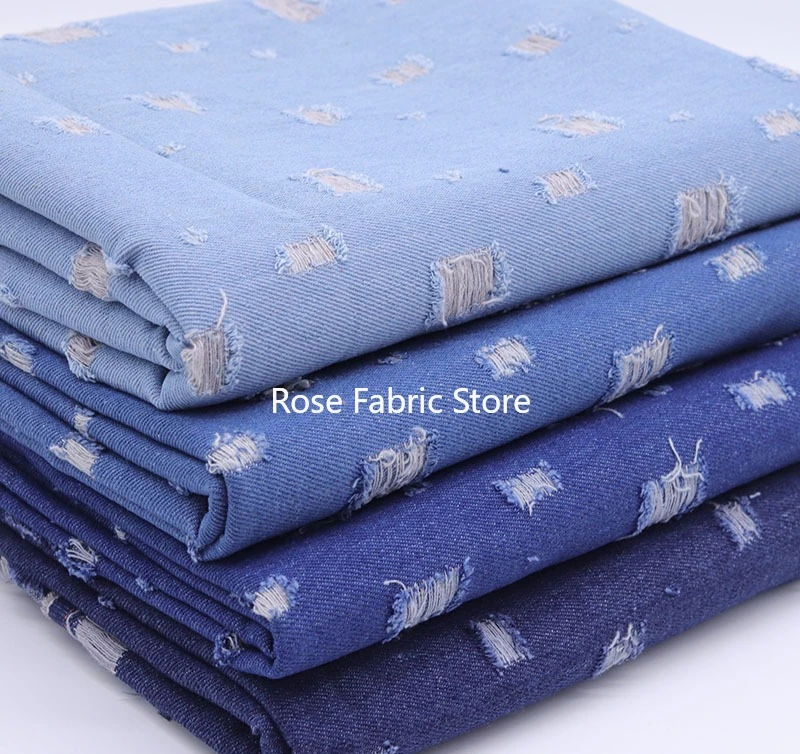 1 meter minimalist perforated distressed washed denim fabric for denim jackets, jeans, dresses, and DIY sewing.