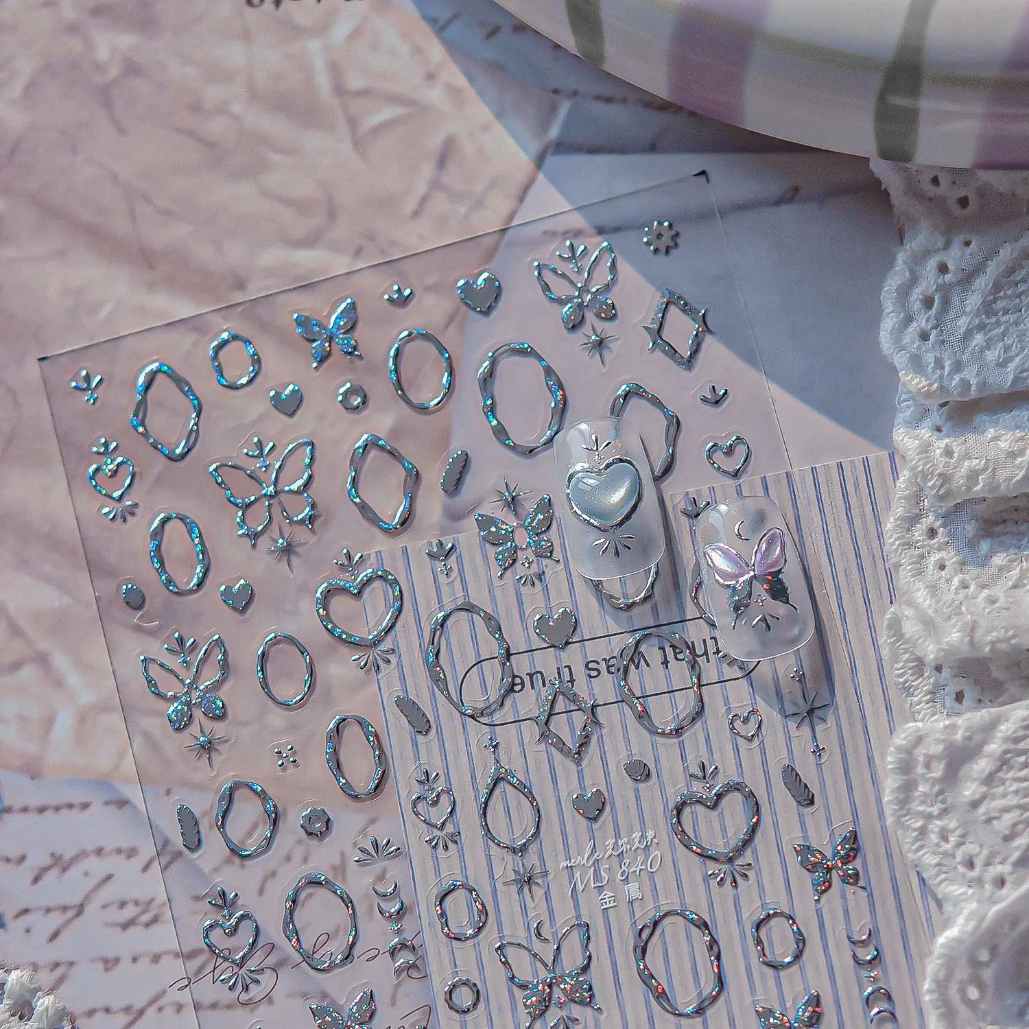 กรอบรูปดาวอัญมณีหรูหรา นาฬิกาทรงไม่สม่ำเสมอ บล็อกโลหะ ดาวเคราะห์ รูปทรงเรขาคณิต ดวงจันทร์ หัวใจ สติ๊กเกอร์เล็บลายเลเซอร์สุดหรู