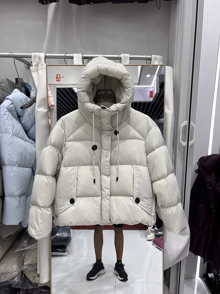 

2025 new hanging rope button design down jacket women's short hooded Korean version loose white duck down jacket trend