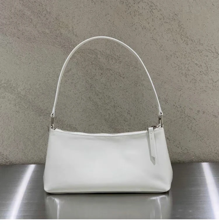 حقيبة يد نسائية ماركة Dearni Dongda Gate 2023 من جلد البقر المطوي اللامع حقيبة تحت الإبط كورية Sle لون نقي