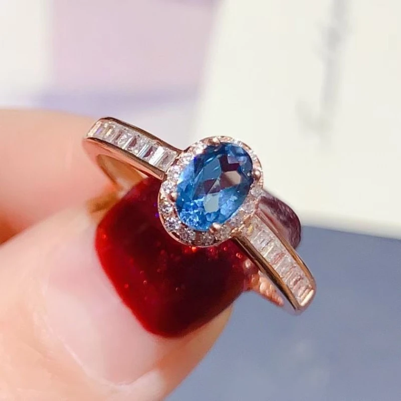 

925 Sterling Silver Natural Blue Topaz Ring for Women, 4x6mm Oval Cut Gemstone Halo Ring, 18K Gold Plated CZ Accent Jewelry Gift