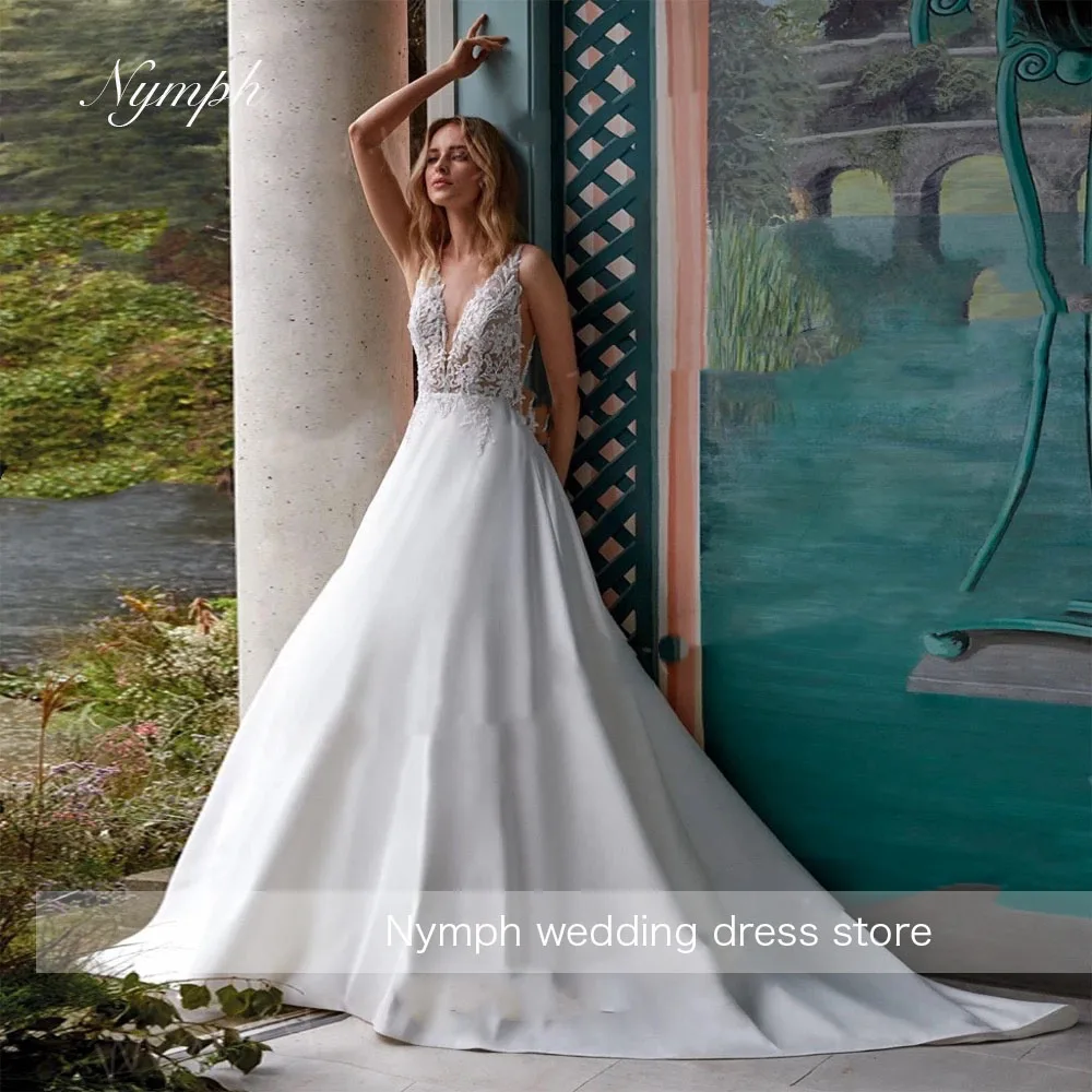 

Customized Modern A Line Women's Wedding Dresses Appliques Lace Bride Gown Charming V Neck Sleeveless Backless Vestidos De Novia