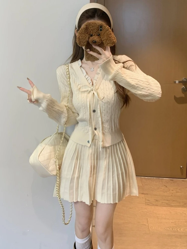 Spring and Autumn new Korean version bow lace-up single breasted V-neck knitted cardigan+pleated short skirt two-piece set