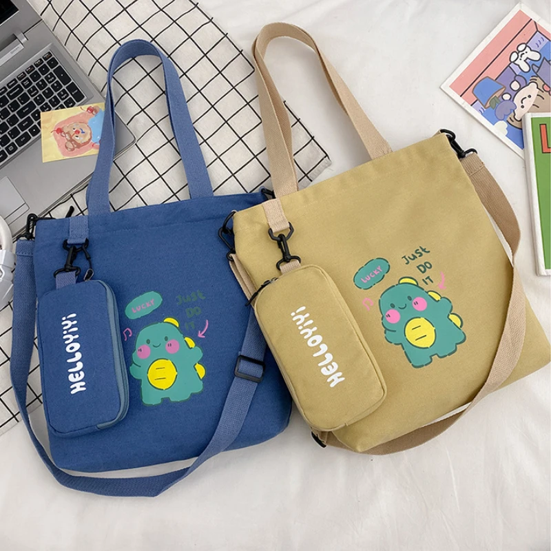 

Cartoon Dinosaur Shoulder Bag School Canvas Single Shoulder Cross Body Handbags Cartoon Printed Student Bags with Pocket