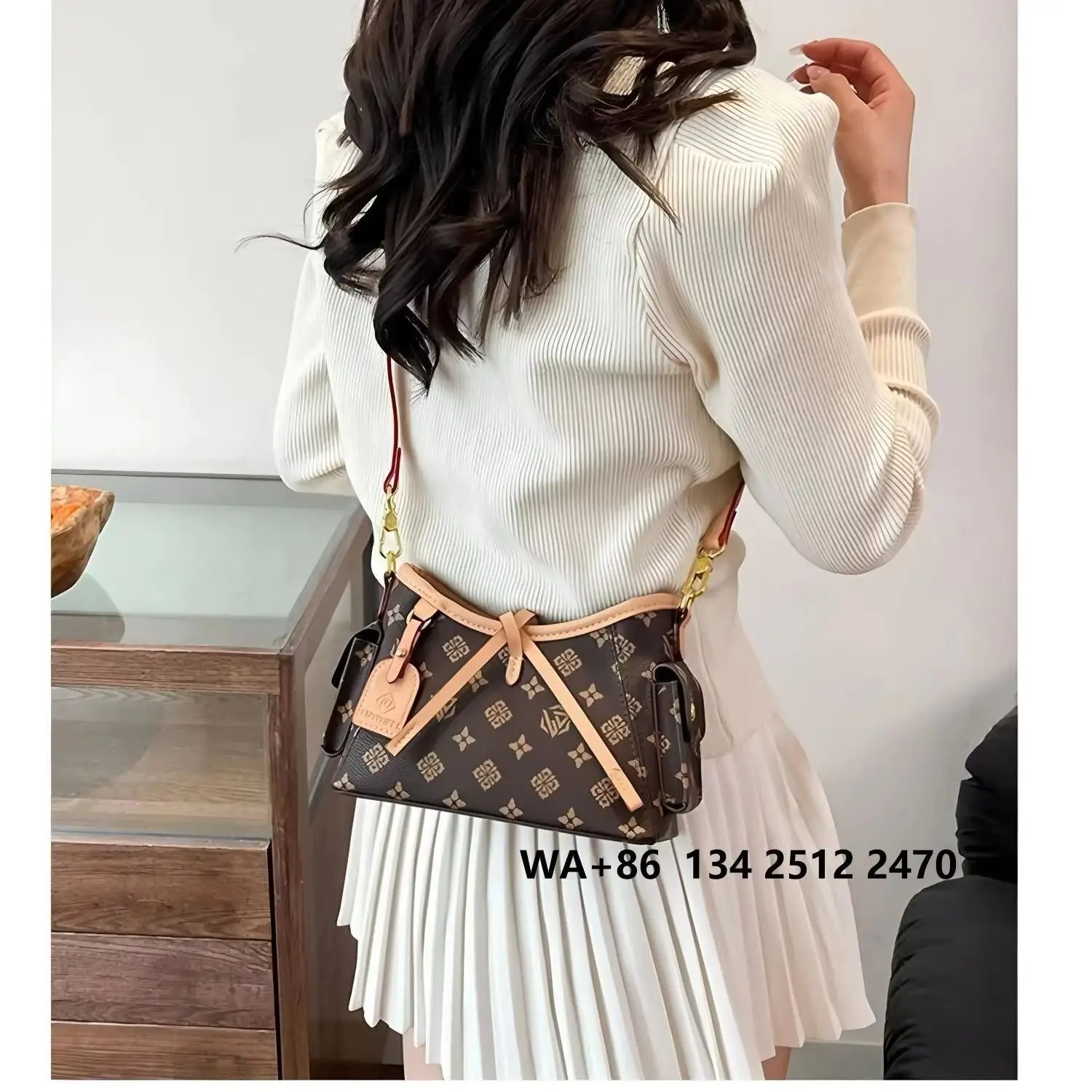 

Vintage letter pattern crossbody bag with a brown leather accented patch, adjustable thin shoulder strap, and a small retro underarm messenger bag.