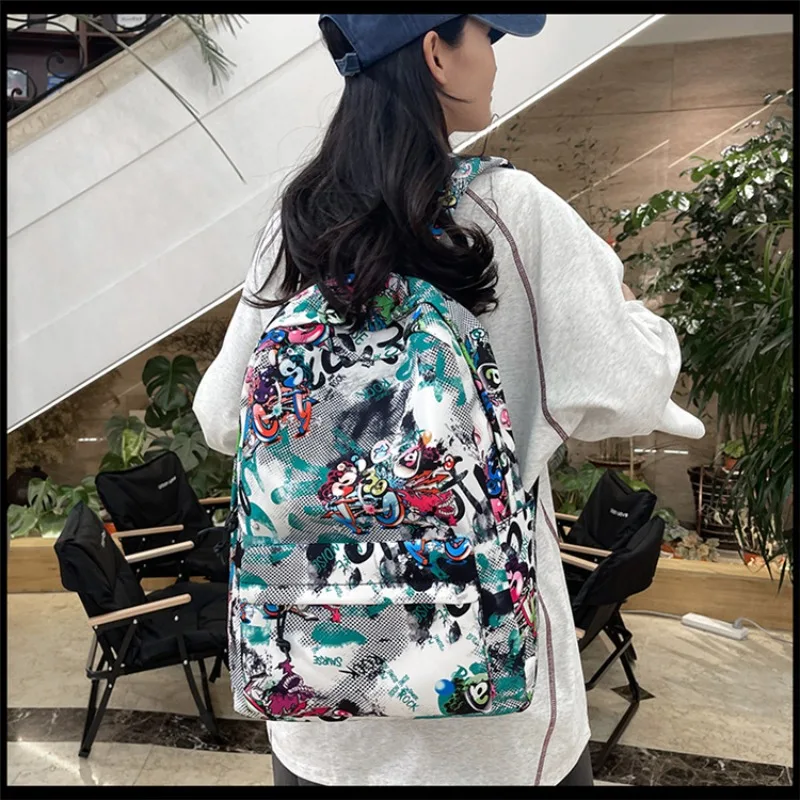 

2025 Новый рюкзак, японский Ins, индивидуальный граффити, модный крутой студенческий школьный рюкзак, большой вместительный рюкзак для отдыха и путешествий