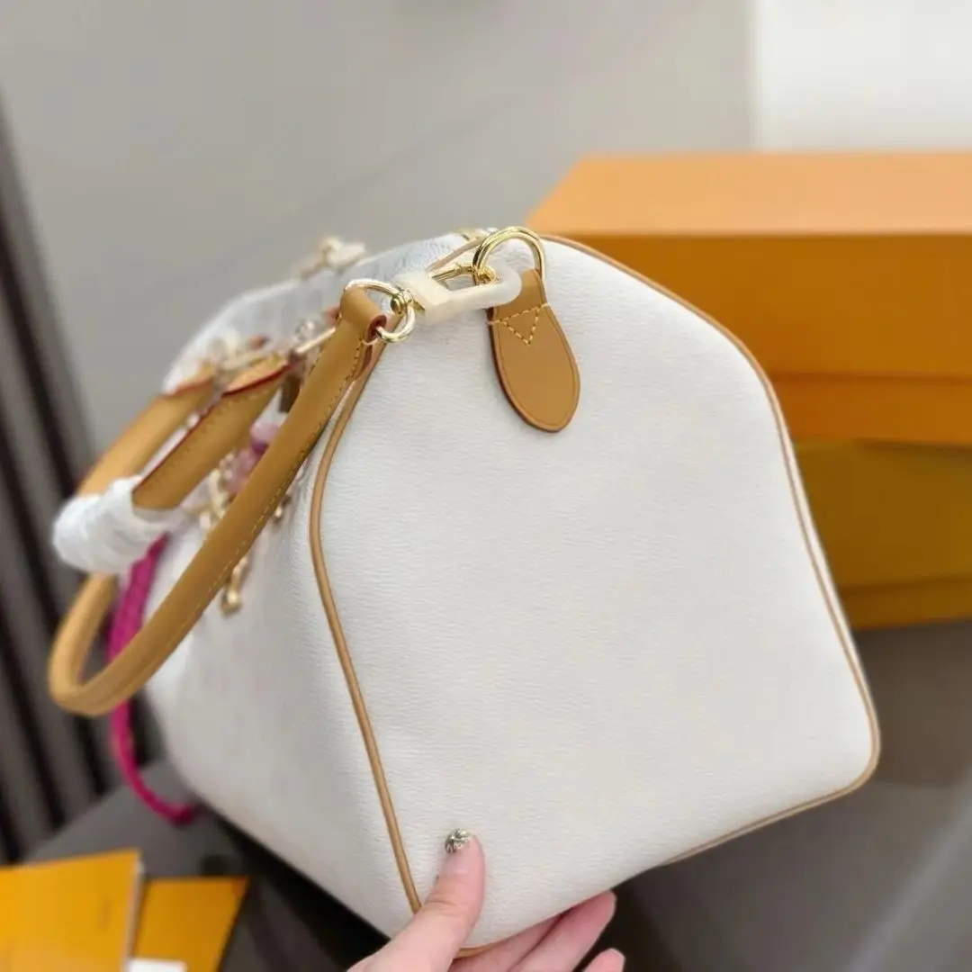 Off White Pebbled Leather & Natural Vachetta Trim Speedy Boston Bag, Multi-Wear Top Handle Crossbody Bag with Adjustable Full Leather Strap & Decorative Lock Chain, Luxury Designer Inspired Fresh Spring Travel Handbag
