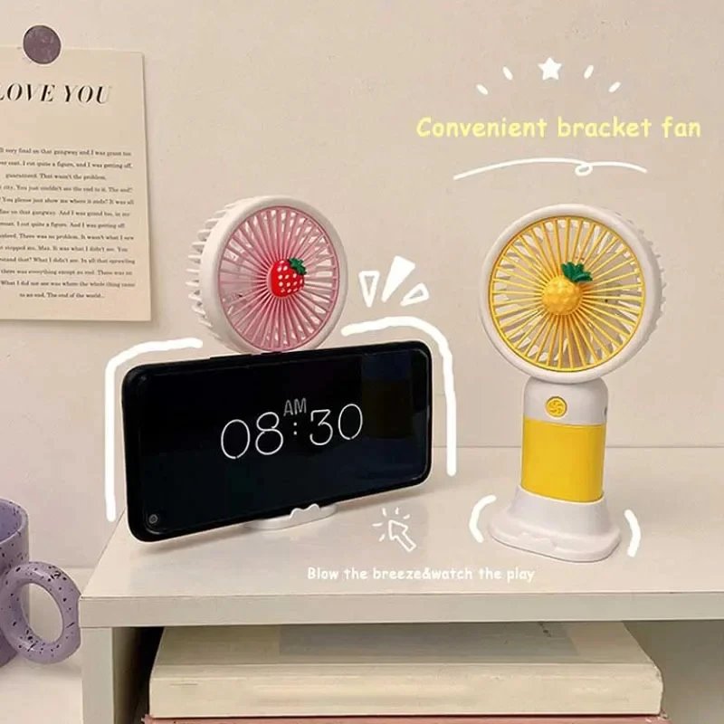 Simpatico Mini ventilatore a mano con frutta con supporto per telefono, dispositivo di raffreddamento estivo all'aperto, ventilatore portatile ricaricabile USB per tasca per studenti