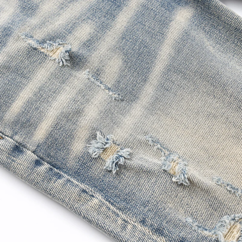

Fashionable new men's jeans with perforated patches, washed with water, retro elastic, slim fit, trendy brand, light blue jeans,