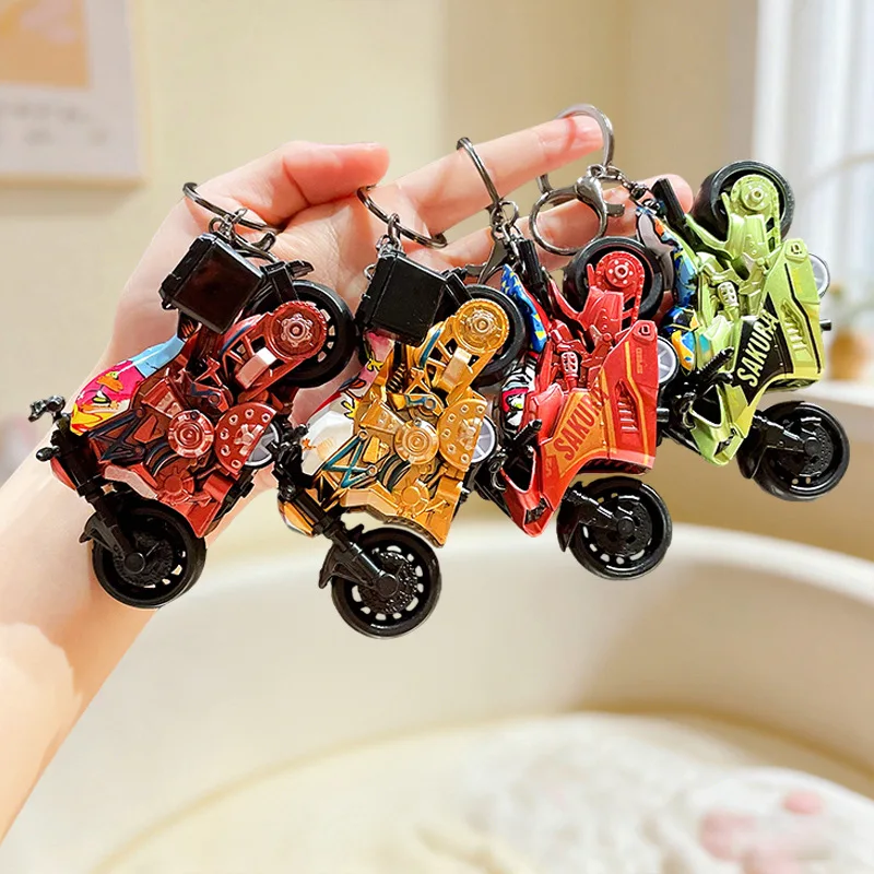 Cartoon Reel Graffiti Gravity Motorcycle Keychain Creative Motorcycle Backpack Accessory Riding Enthusiast Decoration Keyring