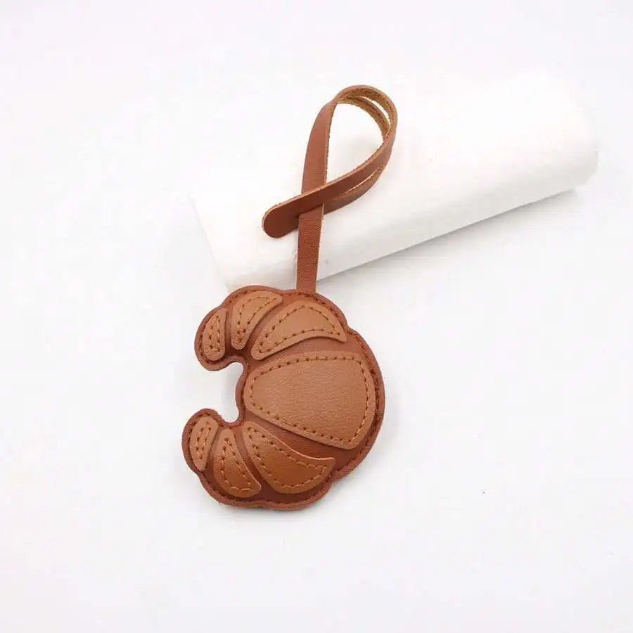 

1pc Bag Charm, Fashion Brown Croissant-Shaped Leather Purse Charm, Practical Portable Decoration Keychain Pendant
