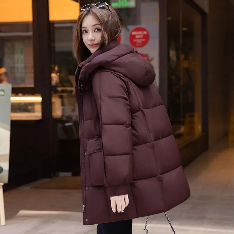 

Зимняя новинка 2025 года, утепленная хлопковая куртка на пуху, женское модное свободное пальто средней длины с капюшоном, женское длинное пальто-парка большого размера