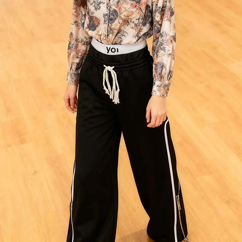 男性と女性の秋のスポーツカジュアルパンツ、ポケット付き、ドローストリング、ストライプ装飾、カップルパンツ