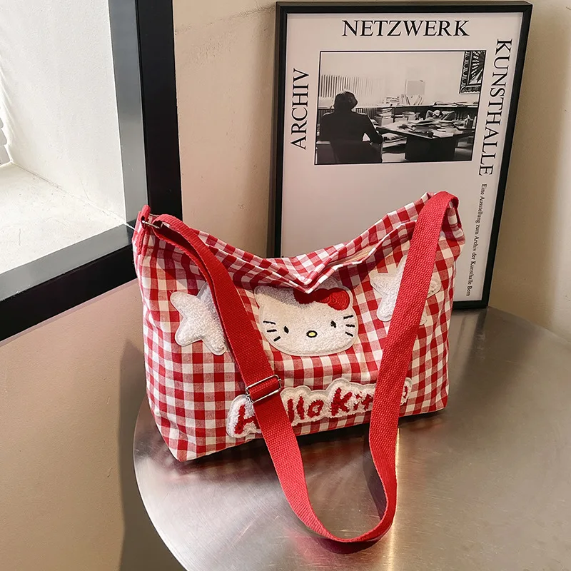 حقيبة كتف منقوشة ناعمة لطيفة من Hello Kitty للسيدات ذات سعة كبيرة وحقيبة قماش كروس للطالبات وحقيبة التنقل اليومية