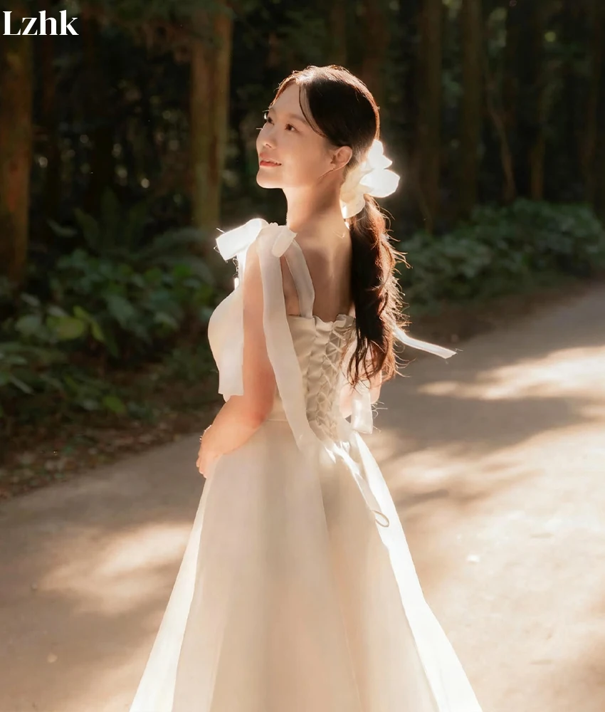 ชุดราตรีทรงเอไลน์ผ้าทูลล์คุณภาพสูงแบบสั่งทำพิเศษ สายเดี่ยวแบบสปาเก็ตตี้ ประดับโบว์ 3 มิติ ดีไซน์ทันสมัย ไม่มีสายคล้องไหล่ สำหรับงานแต่งงาน