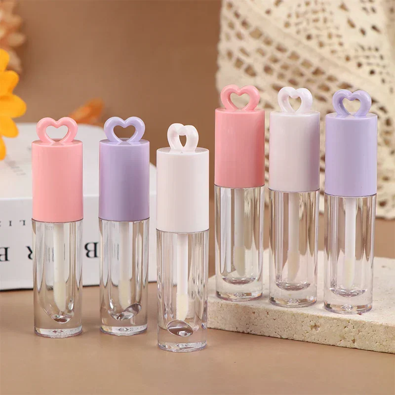 หลอดลิปกลอสทรงหัวใจสีชมพูขนาด 2.5 มล. พร้อมพวงกุญแจและแปรง หลอดลิปกลอสเปล่า ภาชนะใส่ลิปกลอส อุปกรณ์แต่งหน้า