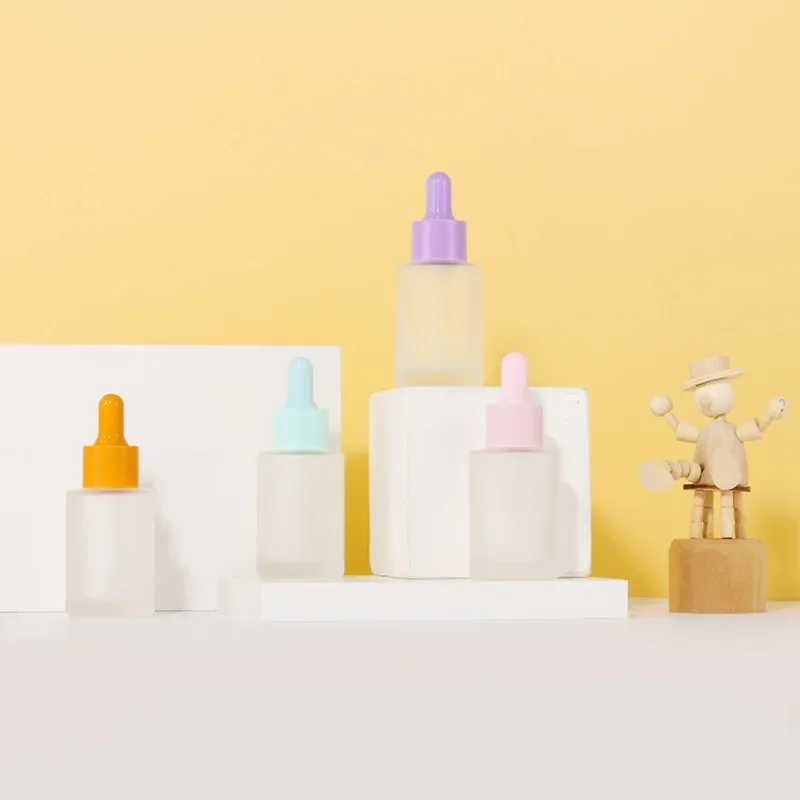 

hot sale Flat Shoulder Glass Dropper Bottle Small Frosted Glass Essential Oil Bottle With Dropper Serum OilDroppercosmeticBottle