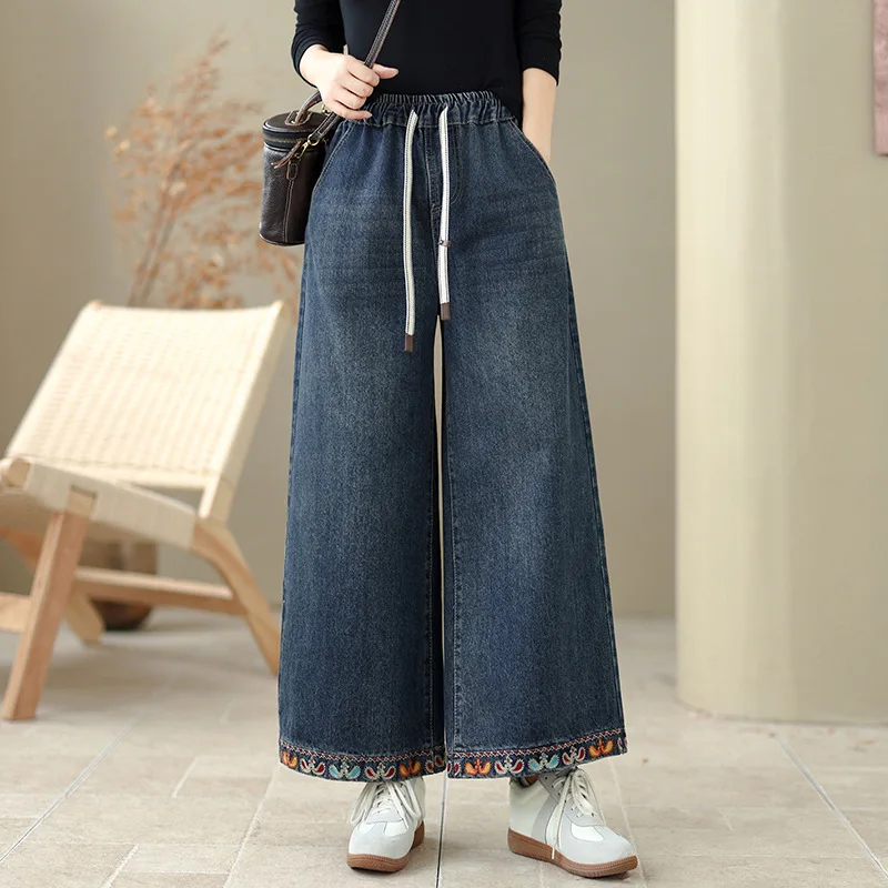 Hoge kwaliteit dames denim broek herfst en winter 2026 etnische stijl bloem geborduurde denim wijde pijpen broek gezellige broek
