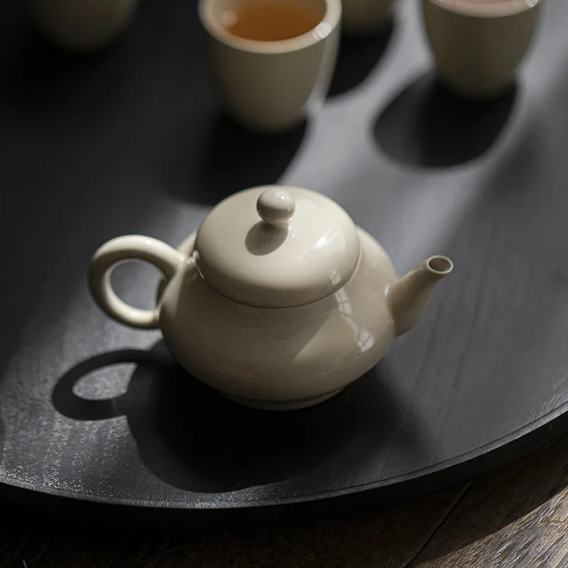 

1Pc Color Glaze Ceramic Teapot Hand-held Kung Fu TeaSet Pot Original Earth Color Household Teapot Ball Hole Filter Hand-held Pot