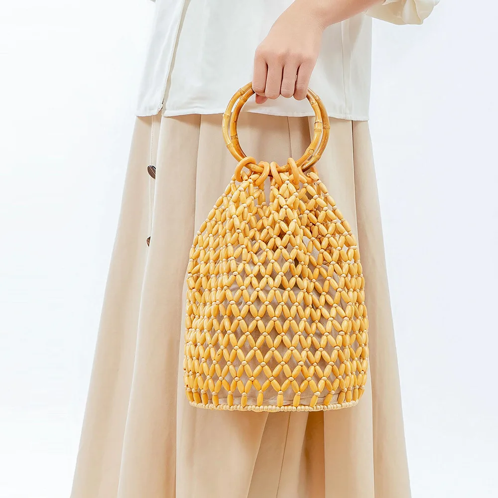 

Woven bag large capacity European and American retro cross-border handmade wooden bead commuter portable bucket bag female