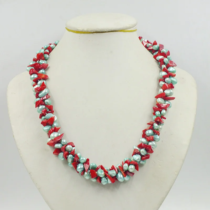 

3 strands of natural baroque pearl and natural irregular red coral. Knit the most beautiful women's necklace. 23 inches