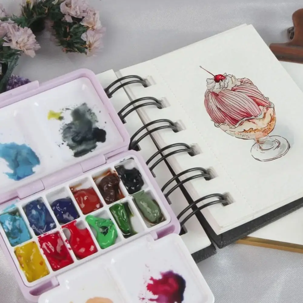 Trendy mini draagbare reis plastic schilderdoos paars palet aquarelverf subpakket 12-roosters pigmentdoos