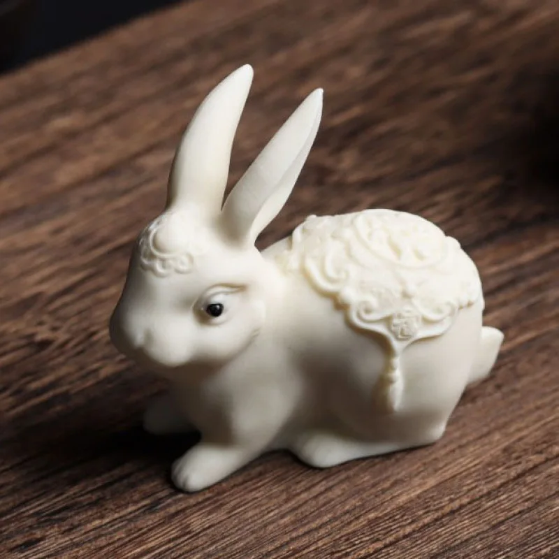 

Ivory Nut Carved Fu Character Rabbit Playing with Hands Small Jade Hare Feng Shui Home Office Decorations Animal Gift