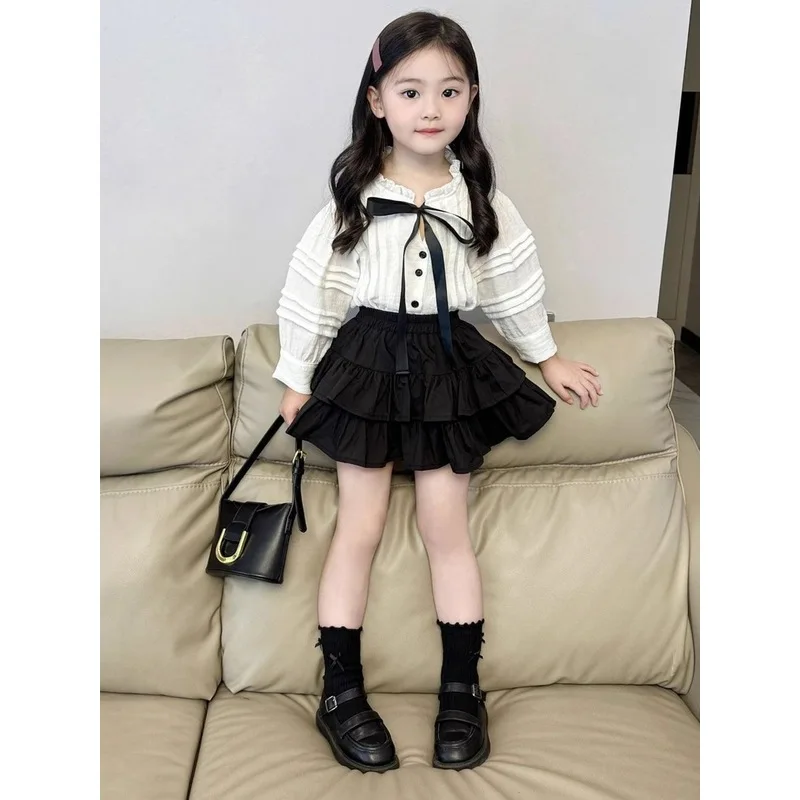 Korean children's clothing new autumn collection: white lace collar bow shirt and black cake skirt two-piece set for girls