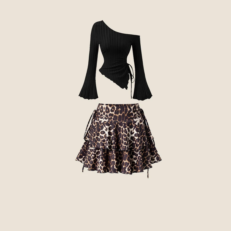 

Модный новый комплект из двух предметов: топ с асимметричными плечами в уличном стиле и мини-юбка А-силуэта с принтом для женщин