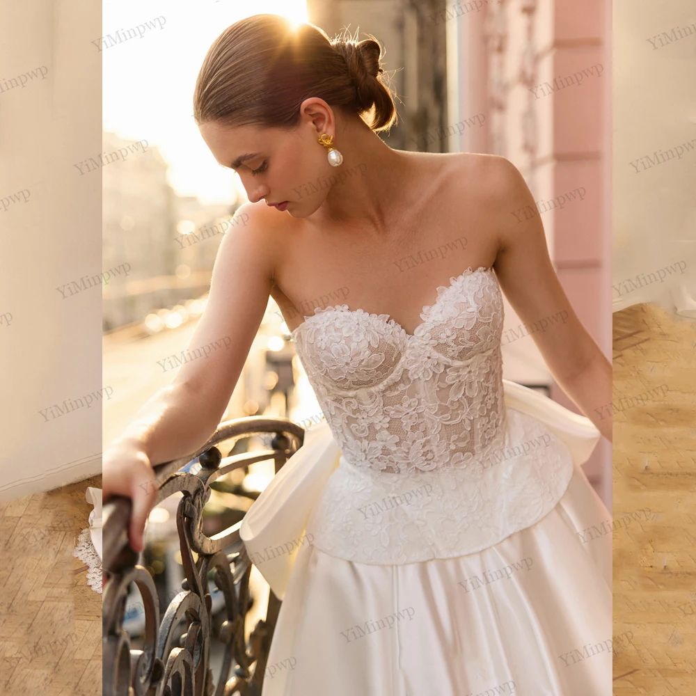 فساتين زفاف عتيقة مع فيونكة بدون حمالات على شكل حرف a فيستدو دي نوفيا بودا مزينة بدون أكمام وأربطة فساتين العروس حسب الطلب