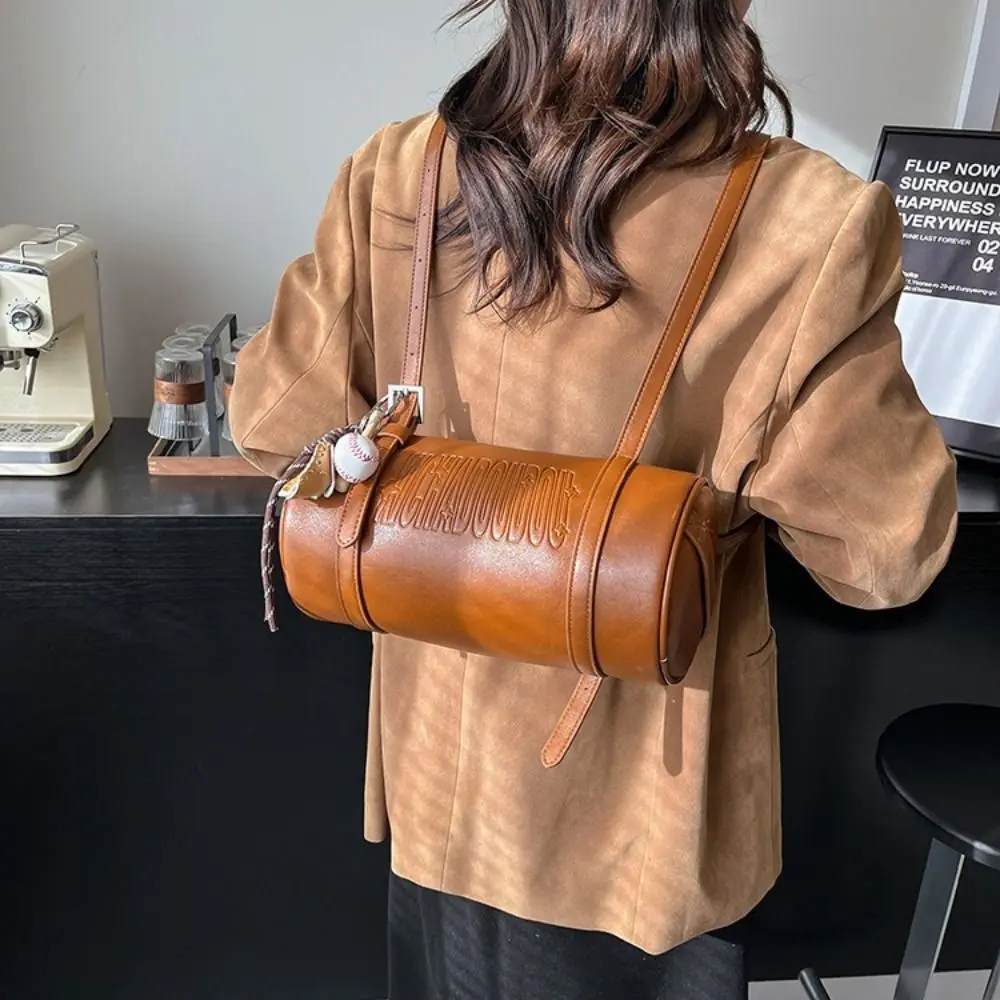 Latest Designer Cylinder Shaped Shoulder Bag With Pendant Solid Color Crossbody Bag Multifunctional Women Backpack