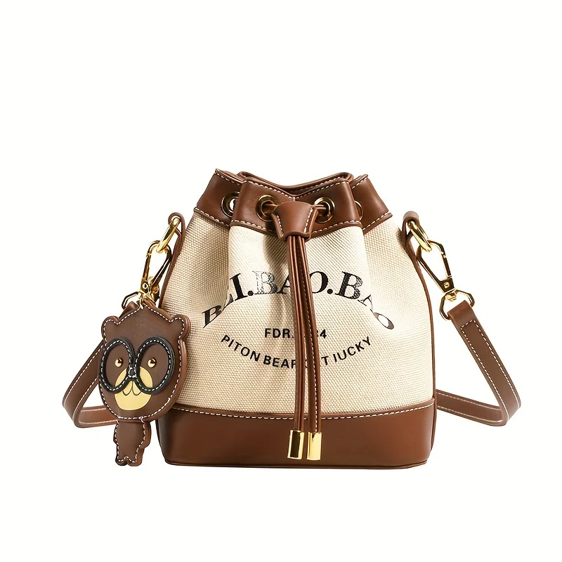 

Chic Canvas Bucket Bag with Letter Design - Crossbody & Shoulder Style with Pendant, Drawstring Closure for Everyday Use