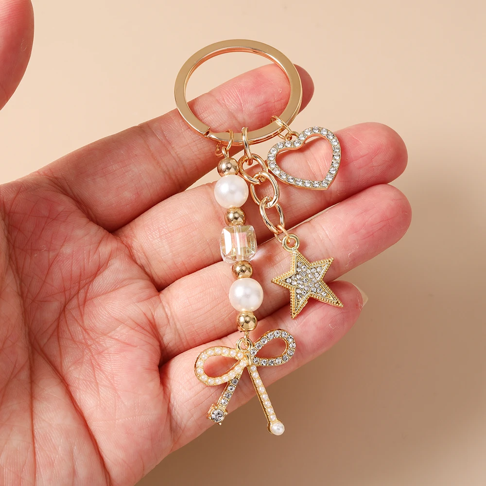 Aihua Exquisiter Schlüsselanhänger in Goldfarbe mit Herz, Stern und Schleife für Damen und Mädchen, Handtaschenanhänger, Dekoration, handgefertigter Schmuck, Geschenke – Detail 6