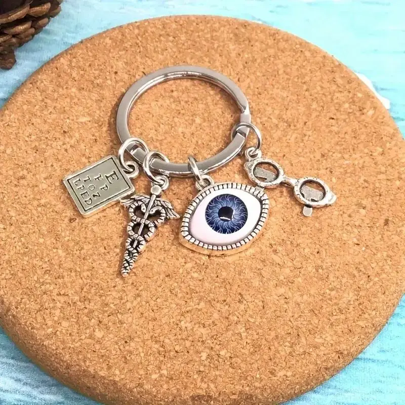 Silvery Charm Keychain With Eye Design, Optometry Themed Keyring With Charms, Unique Accessory For Bags And Keys