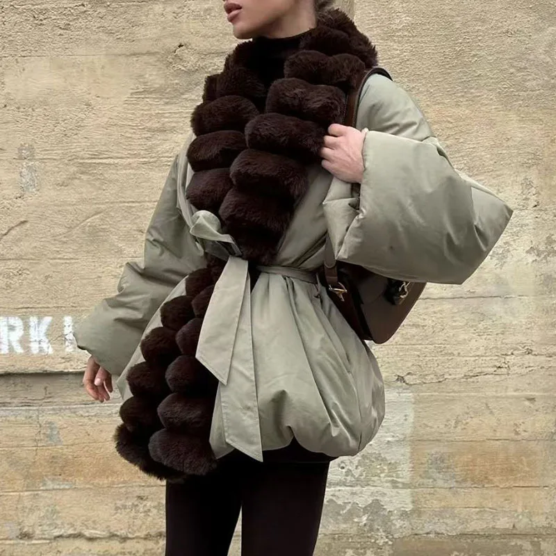 

A mid-length, luxurious and warm cotton-padded jacket with a cotton lapel and a cinched waist for women in winter 2025