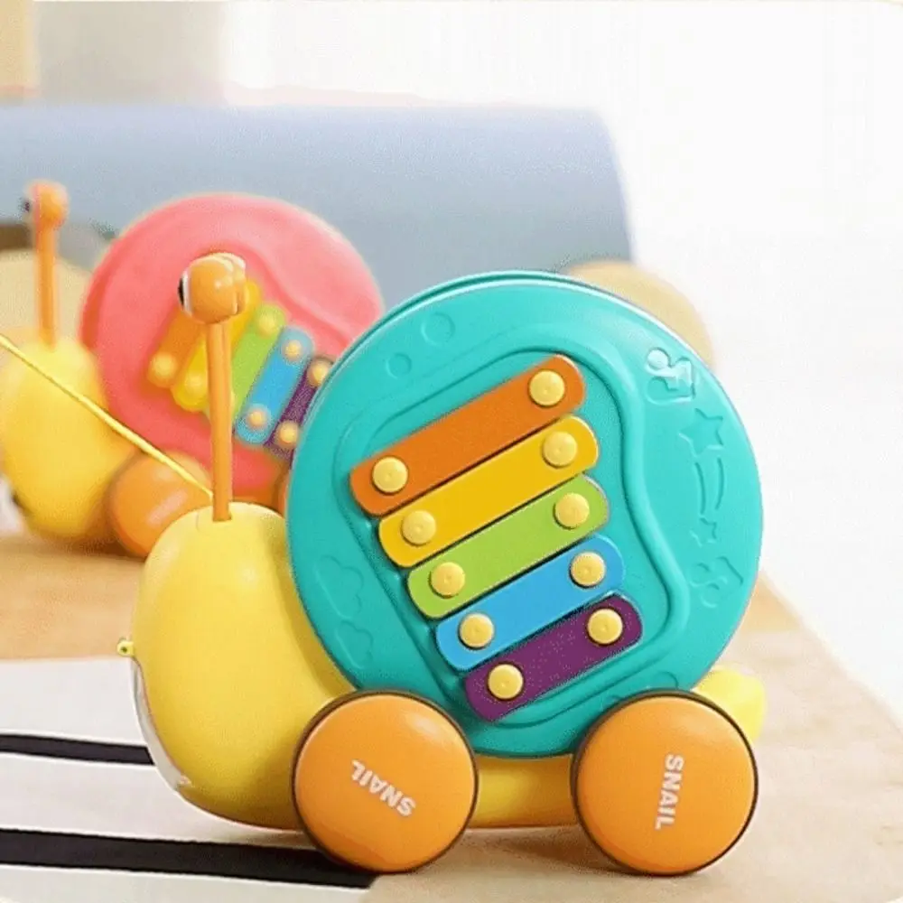 

Baby Walker Pull String Snail Car Toy Learning To Walk Cartoon Pet Drag Rope Snail Knock with Music Pull-Along Snail Toy