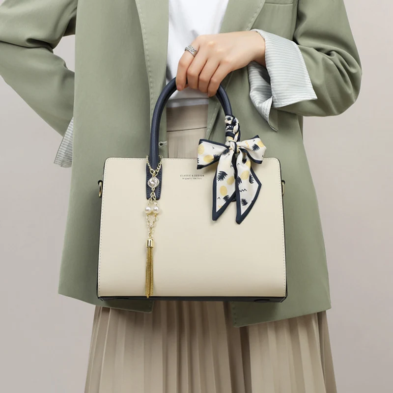 

Женская модная универсальная сумка из натуральной кожи, стильная дизайнерская сумка-мессенджер с подвеской-кисточкой, женская повседневная сумка-тоут для ежедневных поездок на работу.