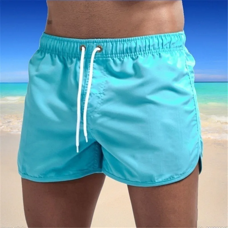 New summer men\'s beach pants swimming quick-drying 3 minutes solid color tube loose drawstring sports shorts