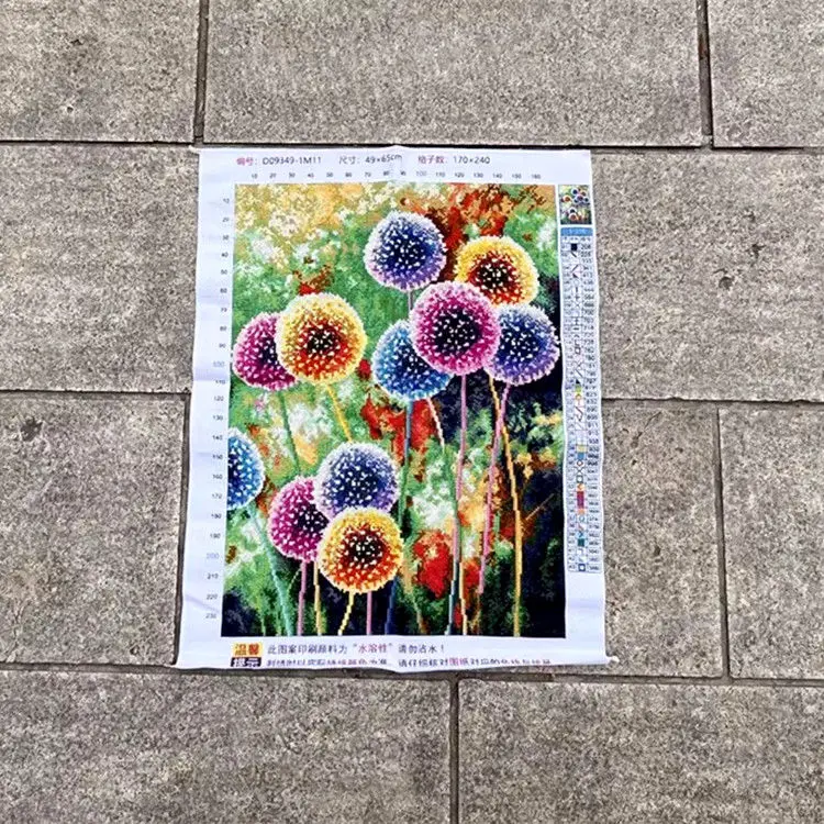 A handmade cross stitch product with seven colored dandelions, plants, flowers, living rooms, bedrooms, and vertical decorative