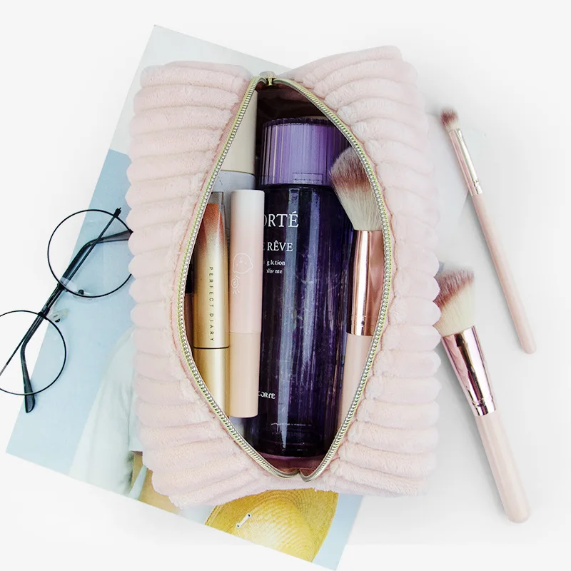 Three-dimensional, non-collapsible, soft, and portable makeup bag with a stylish design