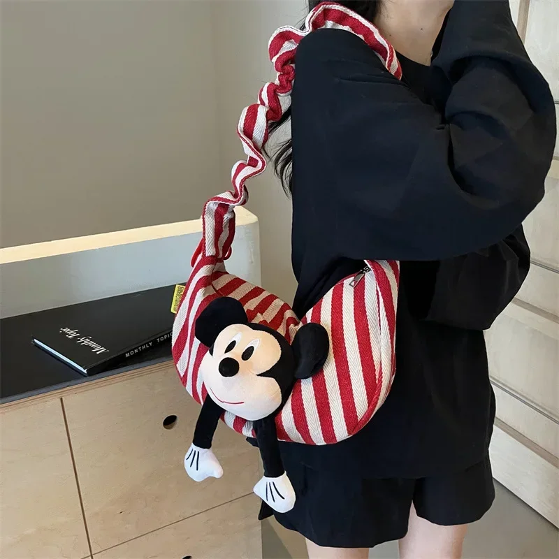 

Disney Mickey Mouse Minnie Doll Canvas Messenger Bag Dumpling storage Bag Female Stripe Fashion Shoulder bag