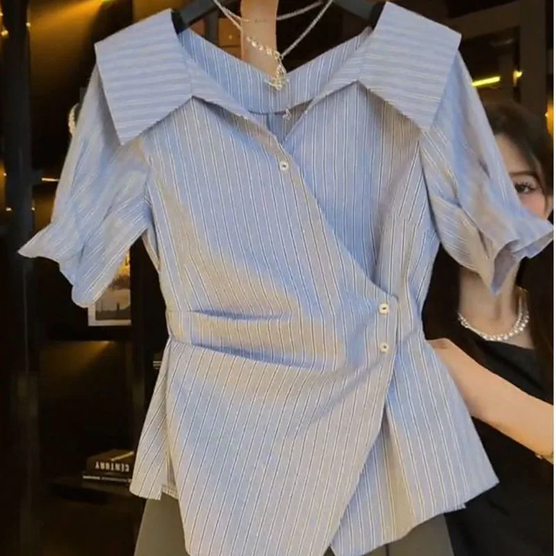 

V-neck shirt female summer high-grade sense irregular French temperament design pleated waist slim short-sleeved shirt