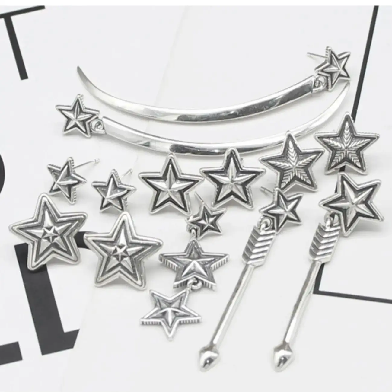 

Punk s925 sterling silver five pointed star male and female earrings, Japanese and Korean personalized bow and arrow stars, vint