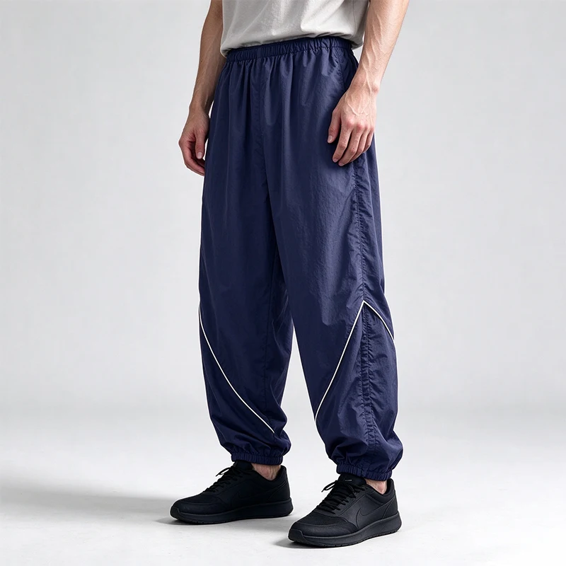 Leichte, schnell trocknende, lockere Nylon-Trainingshose für Herren, Jogginghose mit Kontrastbündchen und elastischem Bund, winddichte Sport- und Freizeithose im Streetwear-Stil. – Detail 7