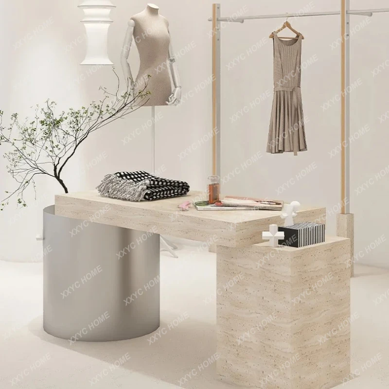 clothing store, display table in the middle of clothing, shoe bag display, storage prop table
