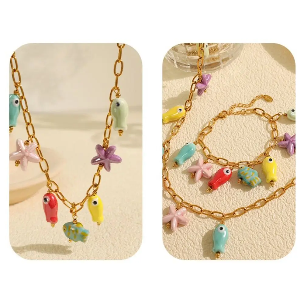 ไทเทเนียมเหล็กเซรามิคสร้อยคอปลาดาว Gold Vibrant Fish Drop สร้อยคอโซ่ปรับเสื่อมเสีย Ocean Theme สร้อยคอ