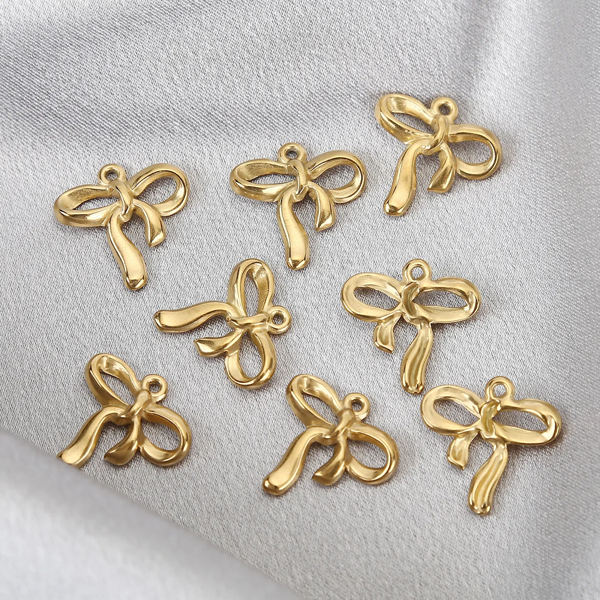 

10pcs Gold Plated Stainless Steel Classic Ribbon Bowknot Pendants Charms For DIY Jewelry Necklaces Earrings Making Findings 19mm