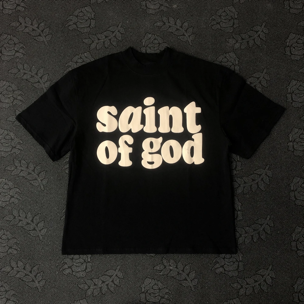 Camiseta Oversized Vintage Verão 2026 com Estampa de Texto São Deus, Camiseta Casual Retrô Streetwear de Manga Curta para Homens e Mulheres